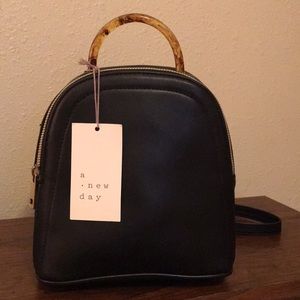 Woman’s mini backpack.